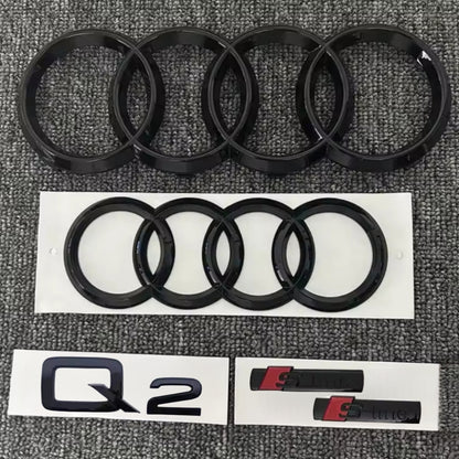 KIT completo LOGHI AUDI Q2 - Nero lucido - Fregi anteriore posteriore targhetta Q2