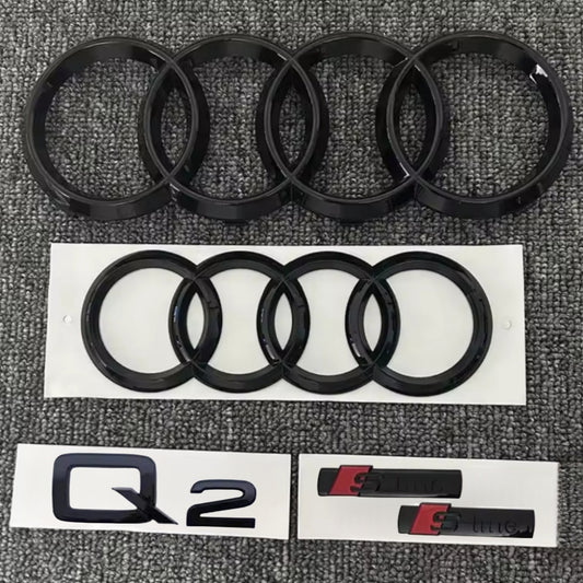 KIT completo LOGHI AUDI Q2 - Nero lucido - Fregi anteriore posteriore targhetta Q2