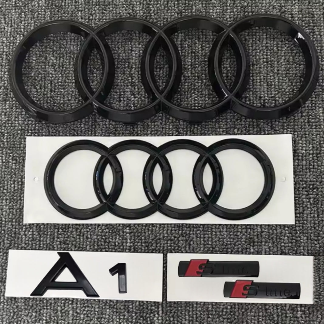 KIT completo LOGHI AUDI A1 - Nero lucido - Fregi anteriore posteriore targhetta A1