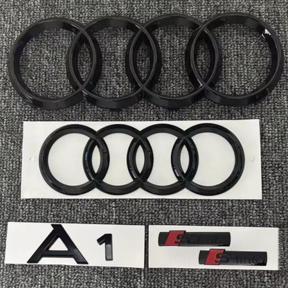 KIT completo LOGHI AUDI A1 - Nero lucido - Fregi anteriore posteriore targhetta A1