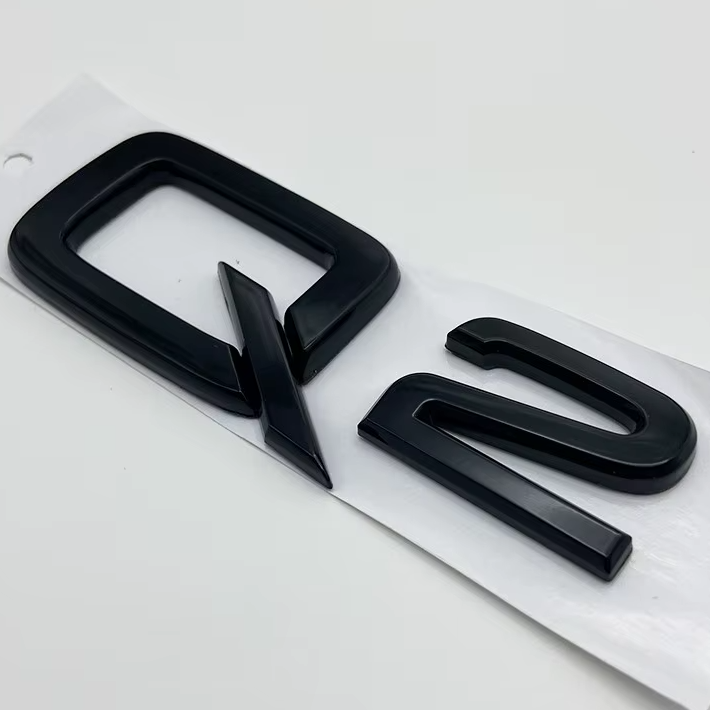 KIT completo LOGHI AUDI Q2 - Nero lucido - Fregi anteriore posteriore targhetta Q2